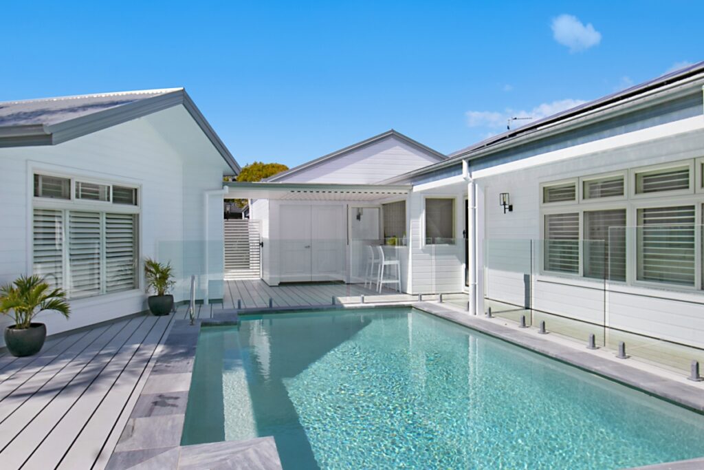 Concrete Pool in a Backyard Setting - A beautifully crafted concrete pool, enhancing the outdoor space and providing a luxurious area for relaxation and enjoyment.