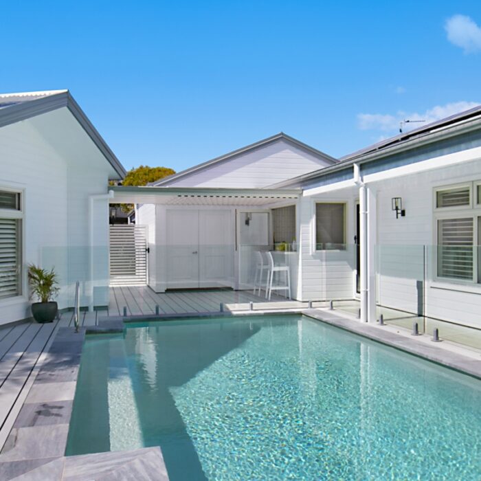 Concrete Pool in a Backyard Setting - A beautifully crafted concrete pool, enhancing the outdoor space and providing a luxurious area for relaxation and enjoyment.